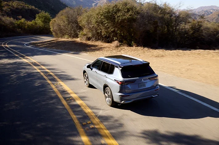 The Outlander cornering on a road