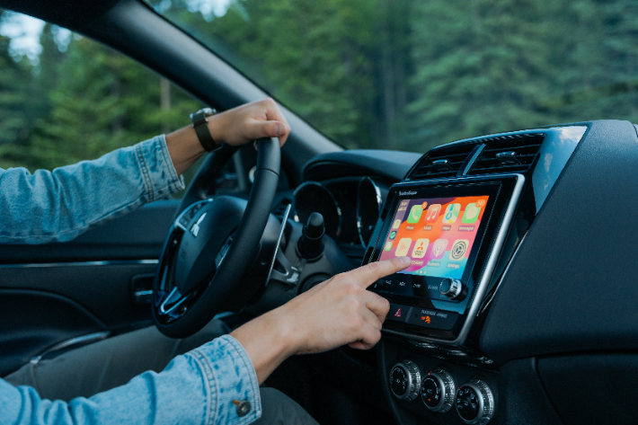 A man using the Smartphone Link Display Audio system in the RVR