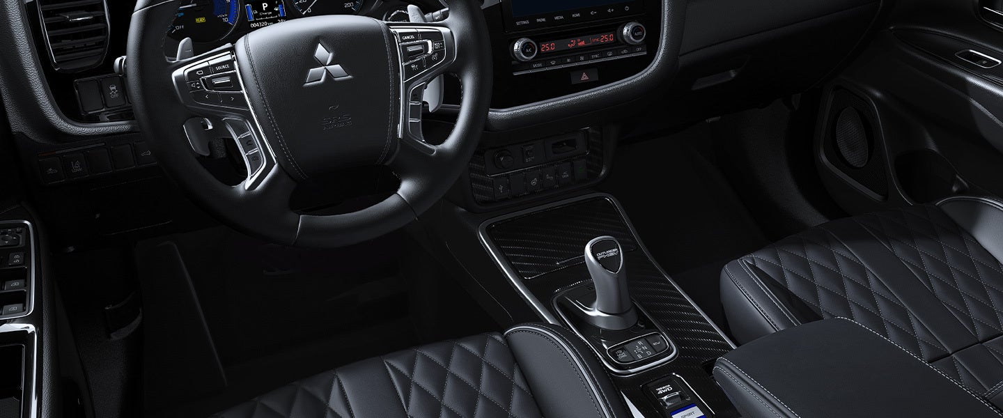 Light gray seating interior with white stitching in the 2022 Mitsubishi Outlander PHEV electric SUV
