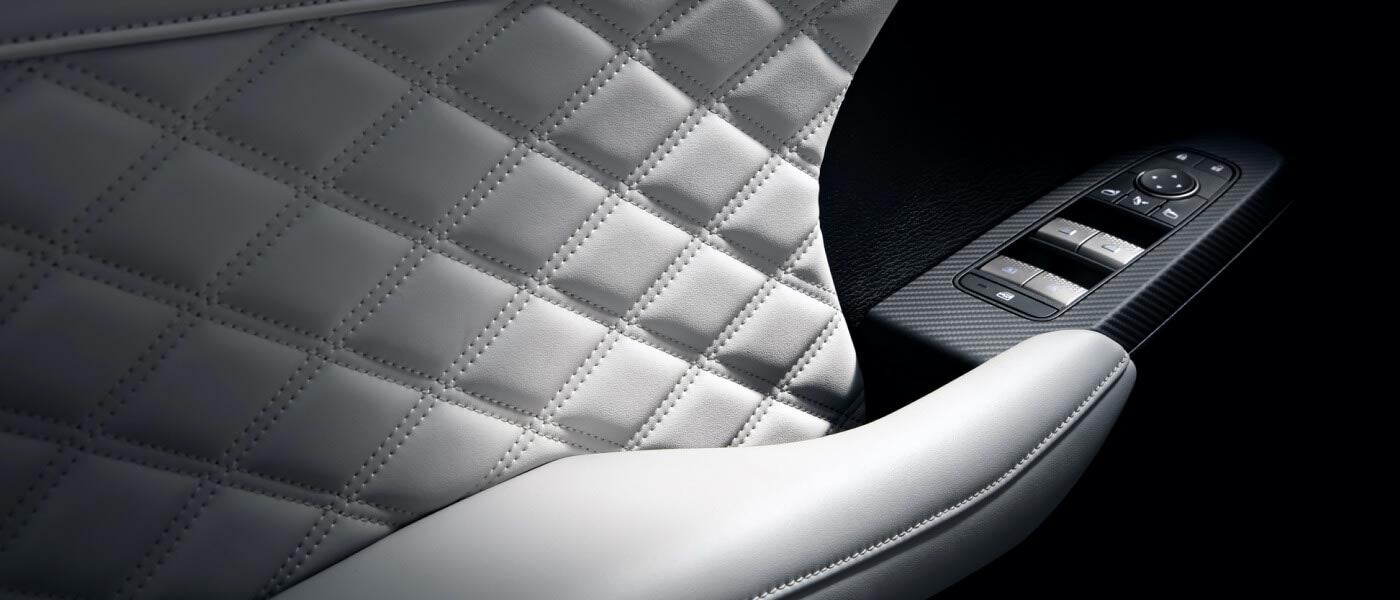 White door handle interior in the 2022 Mitsubishi Outlander SUV